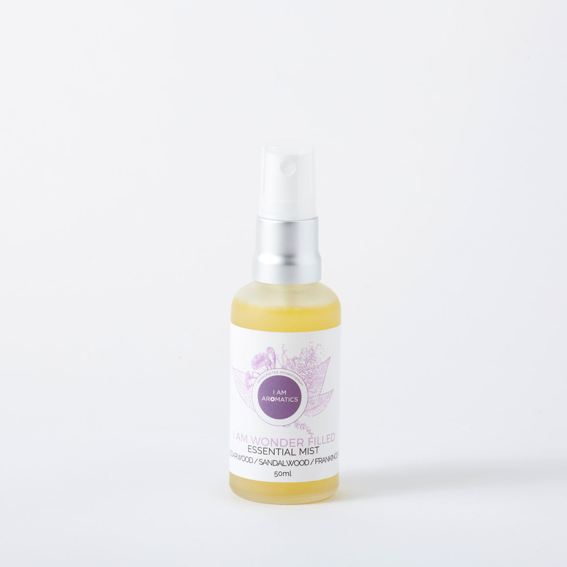 Wonderfilled essential mist, yellowish liquid in frosted 50ml glass bottle with matt silver atomiser, white label with purple botanical logo and font