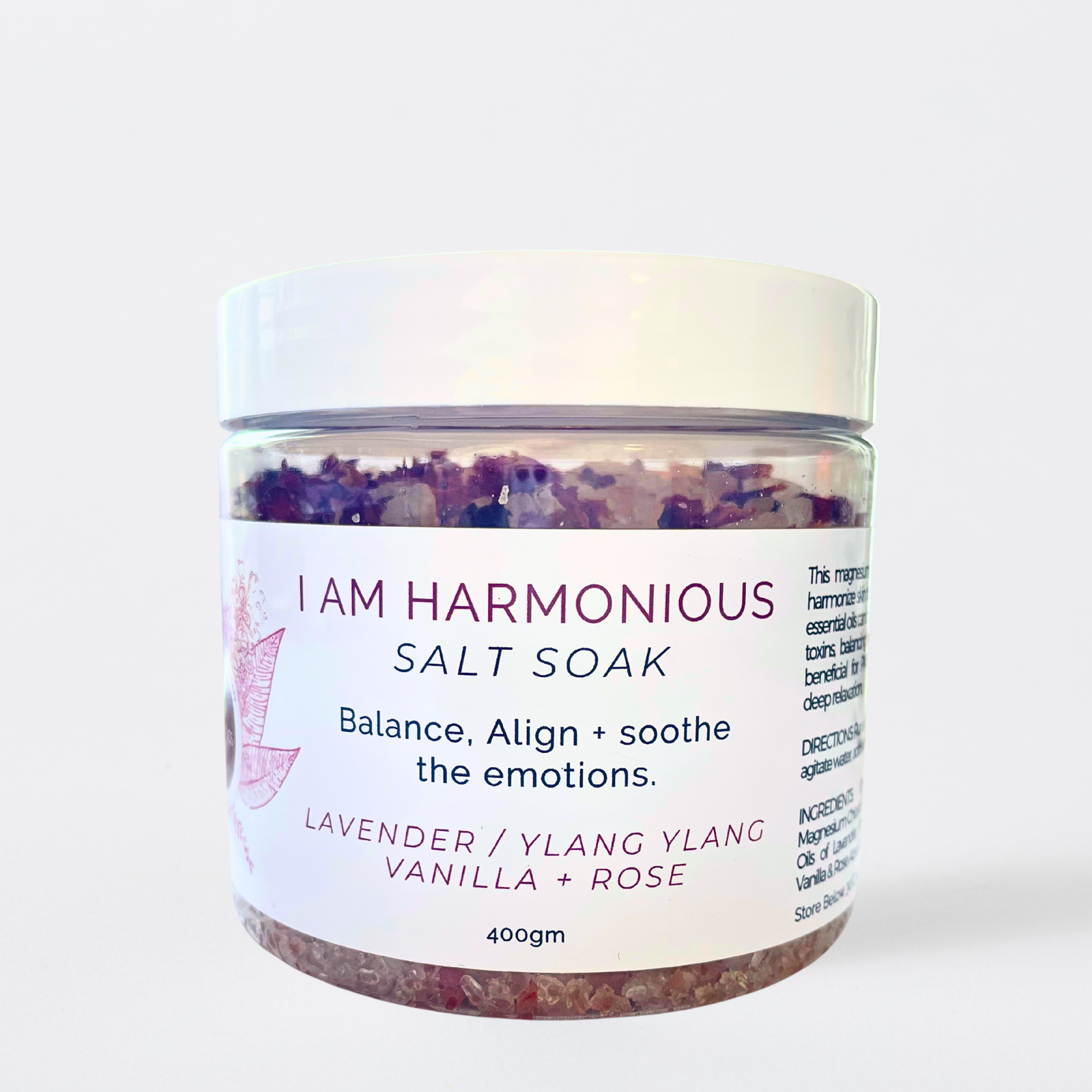 Jar of 'I Am Harmonious' salt soak with a white label on a light background