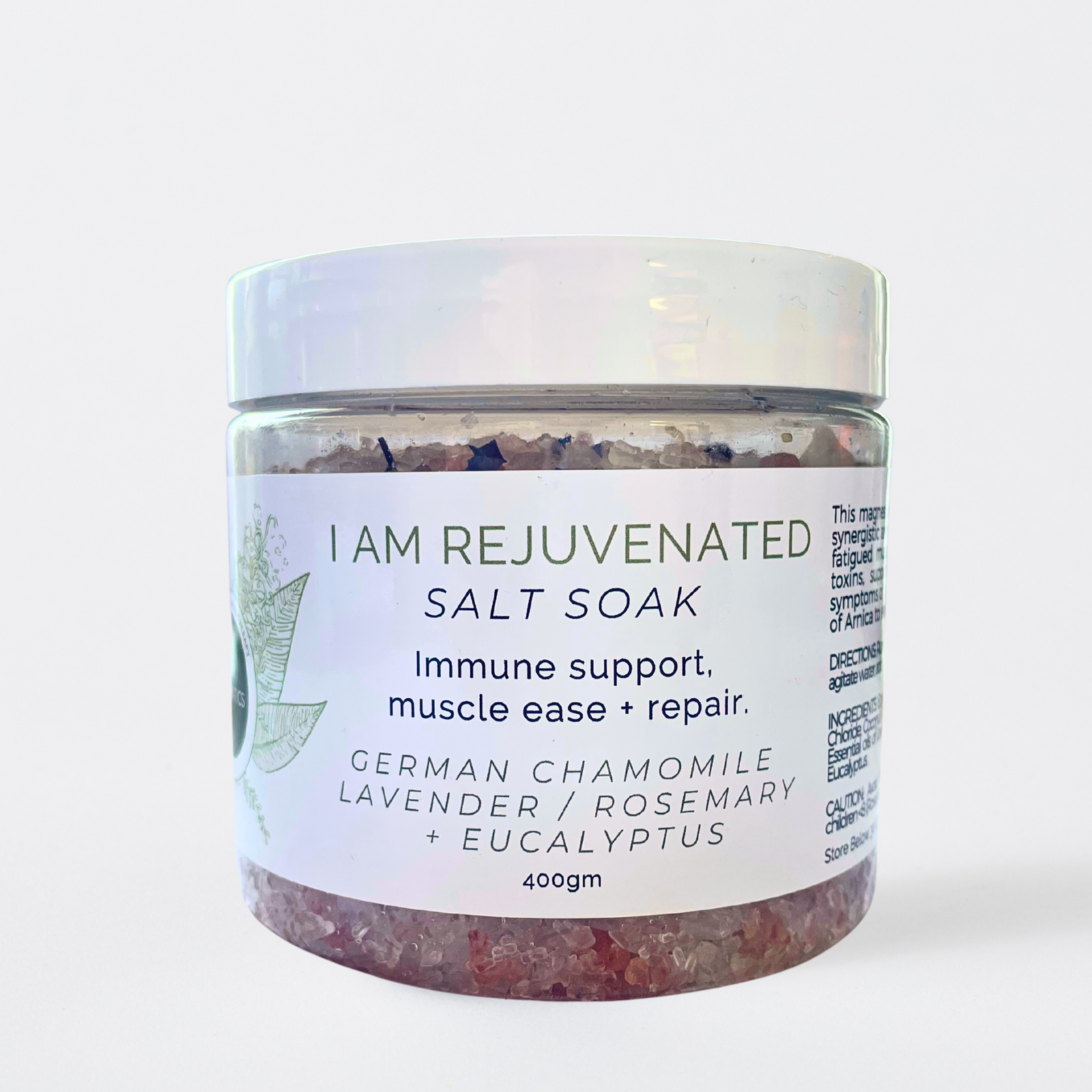Jar of 'I AM REJUVENATED' salt soak with a white label on a light gray background
