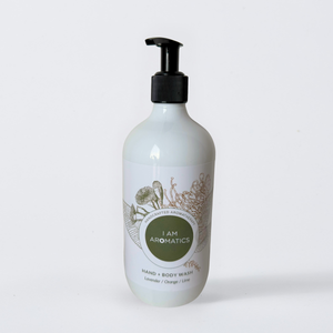 I Am Aromatics I Am Clean Hand and Body Wash with orange scent, showcasing a clear bottle with orange-colored liquid and pump dispenser.