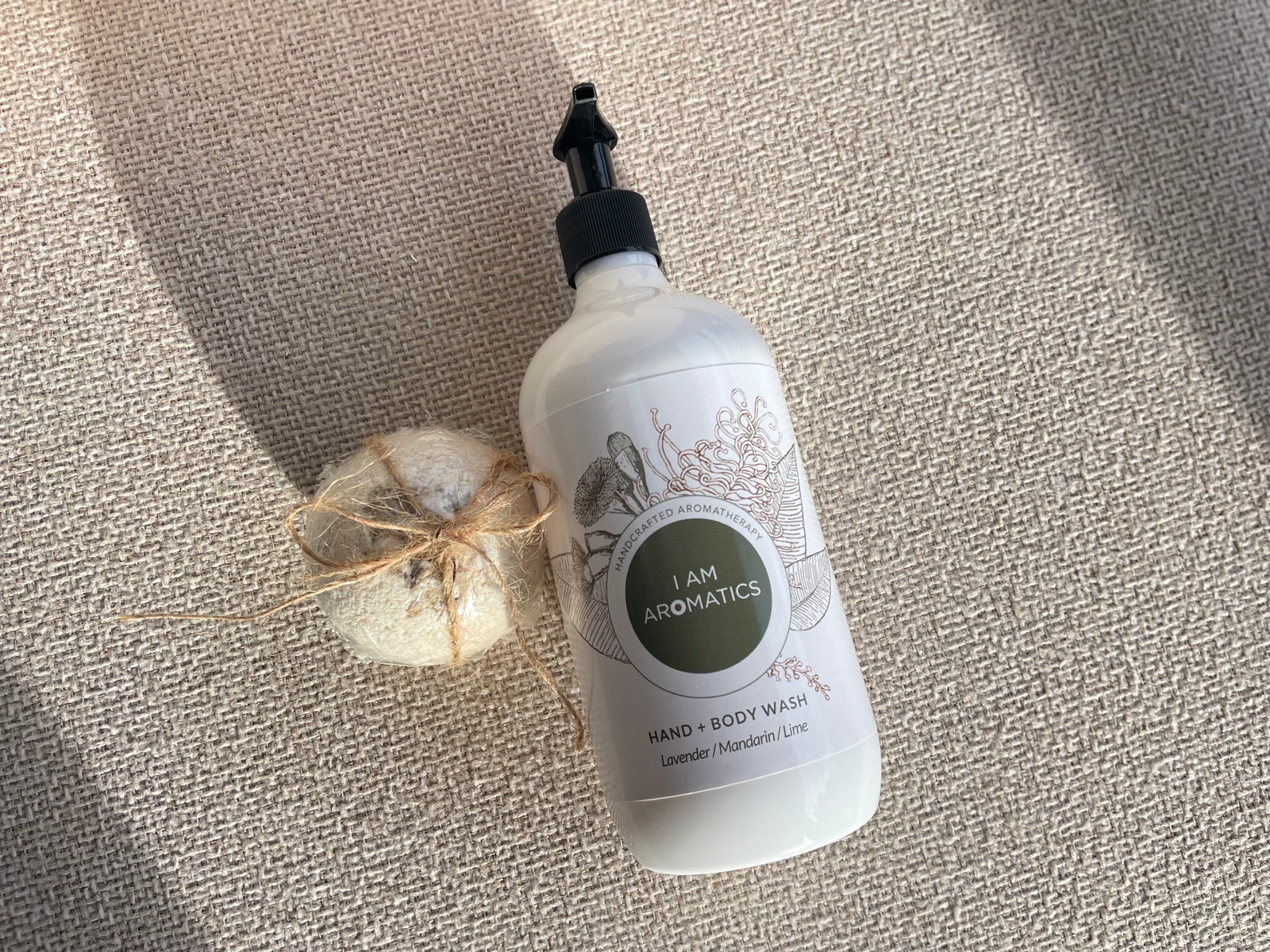 Nature's Bath Duo by I Am Aromatics including a toxin-free botanical body wash and a handcrafted shea butter and clay bath bomb for a natural bathing ritual.