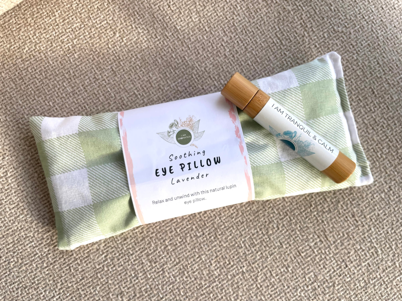 I Am Aromatics Sanctuary Duo featuring a lightweight lupin-filled eye pillow and a Tranquil + Calm natural perfume roller for rest, meditation, and sleep support.