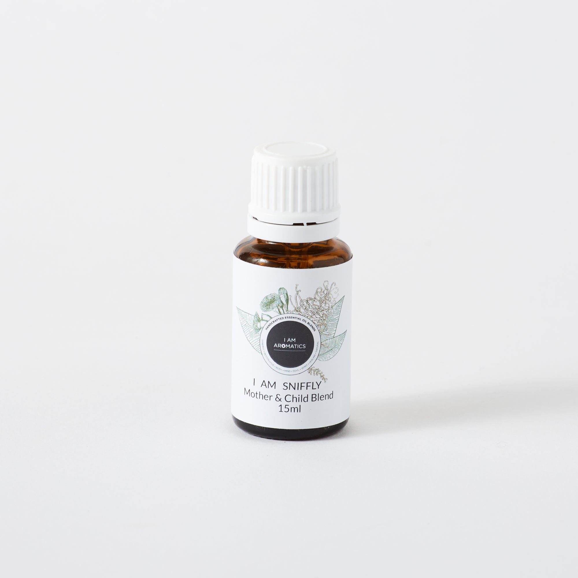 i am sniffly essential oil blend in 15ml amber bottle wiht white lid, white label and botanical logo