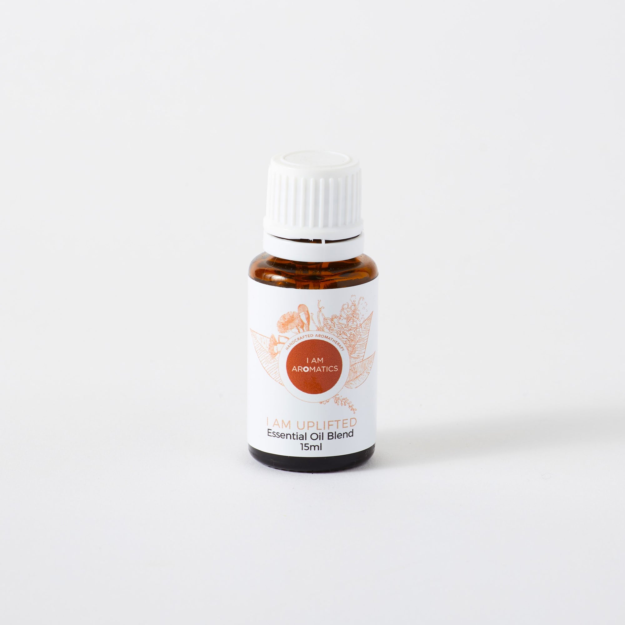 i am uplifted essential oil blend in 15ml amber bottle with white lid, white label and orange botanical logo