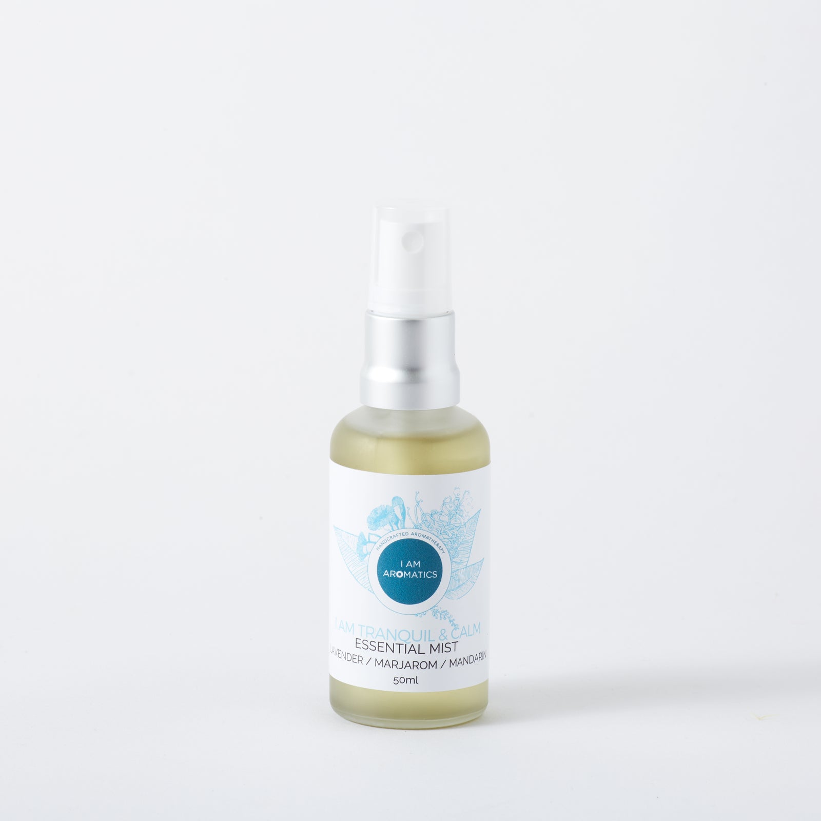 tranquil and calm mist in 50ml frosted glass bottle with matt silver atomiser, white label with blue botanical logo