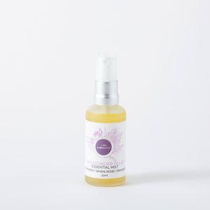 Wonderfilled essential mist, yellowish liquid in frosted 50ml glass bottle with matt silver atomiser, white label with purple botanical logo and font