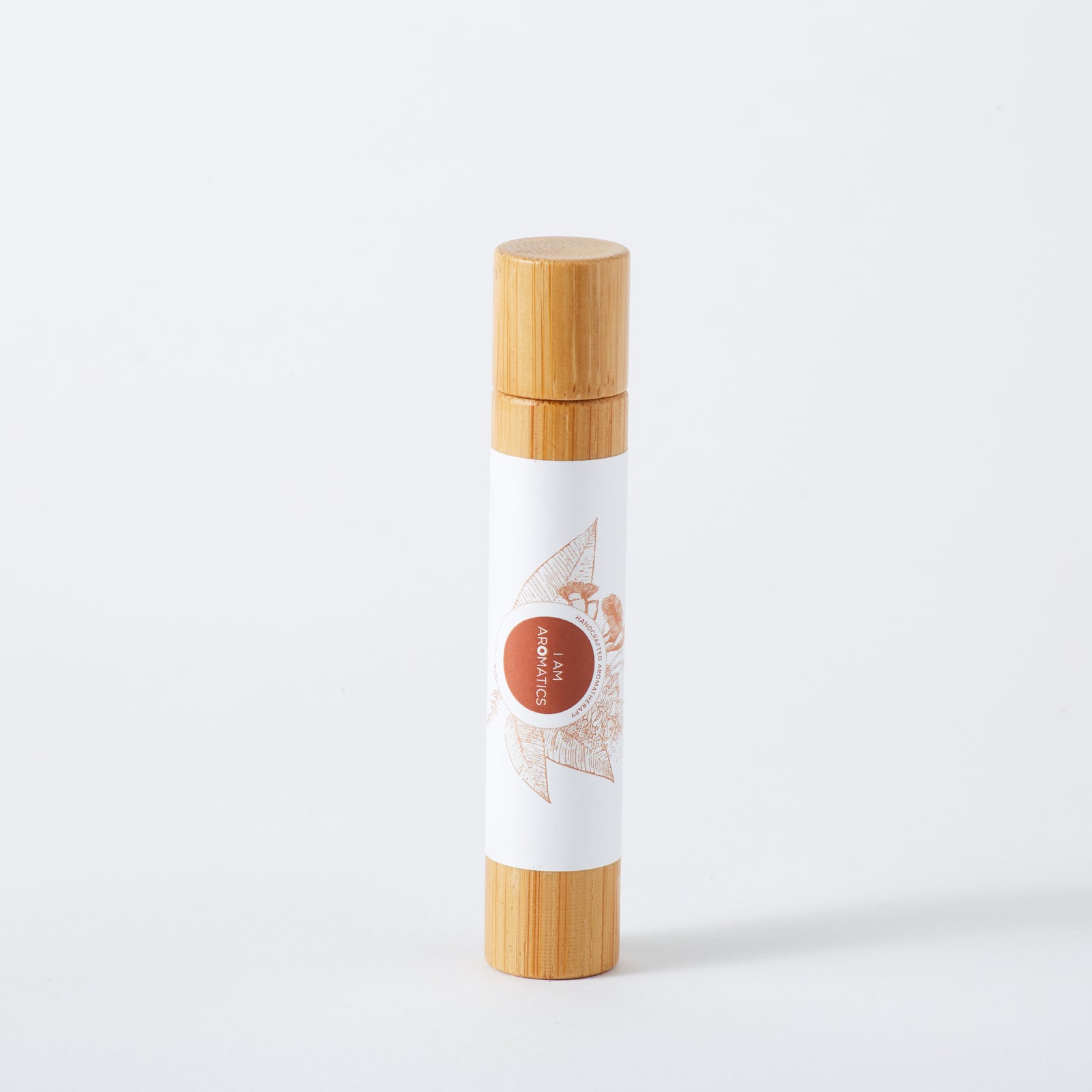 Uplift & focus natural perfume in 10ml bamboo roller bottle, white label with orange botanical logo