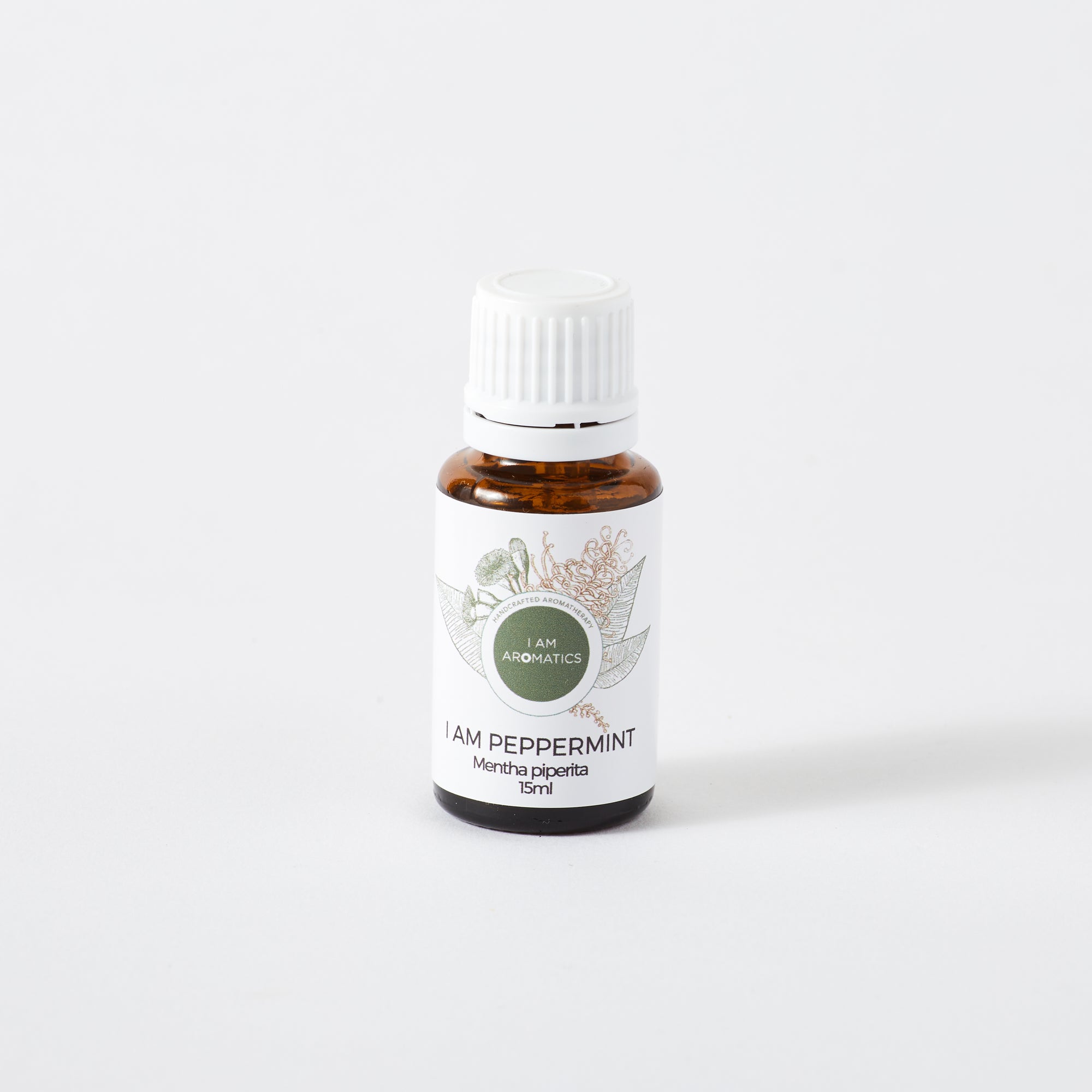 Peppermint essential oil in 15ml amber bottle with white label and white lid, botanical logo