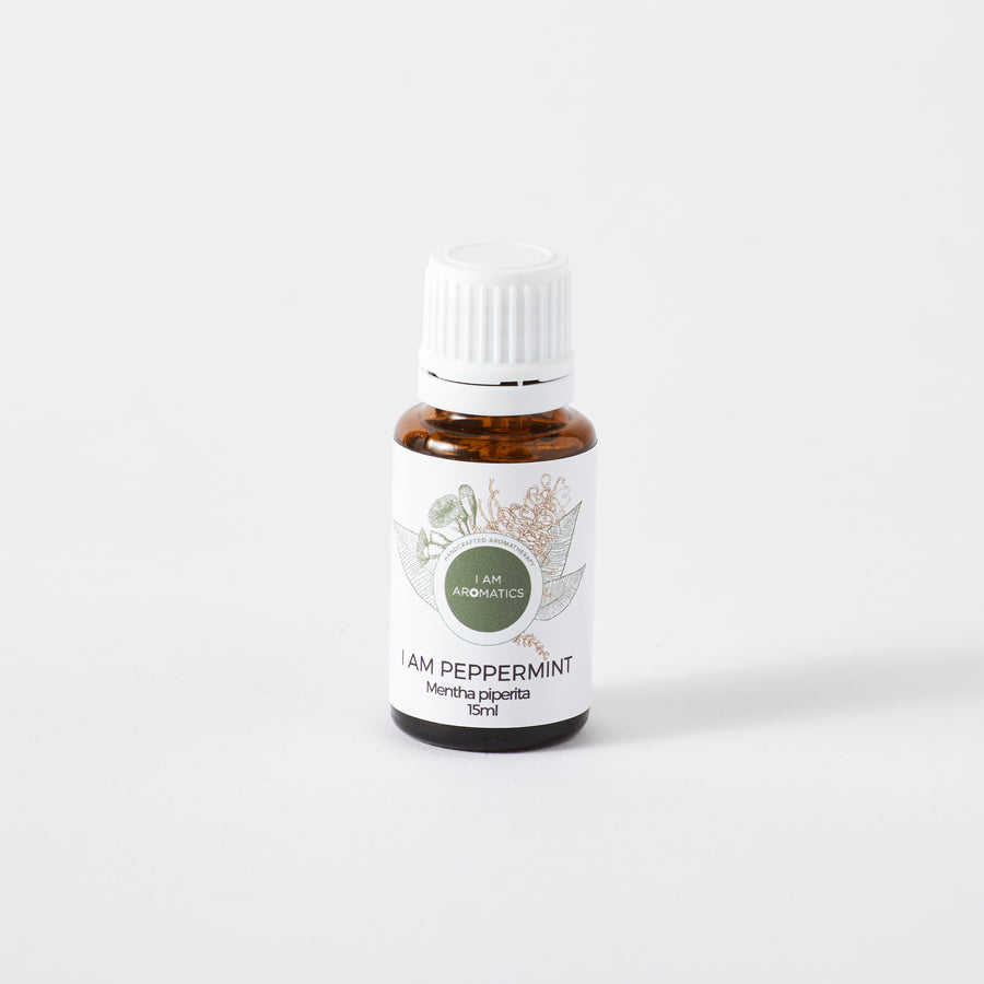 Peppermint essential oil in 15ml amber bottle with white label and white lid, botanical logo