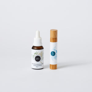 flower essence in 30ml amber bottle with white droper lid, alongside tranquil natural perfume in 10ml bamboo roller.